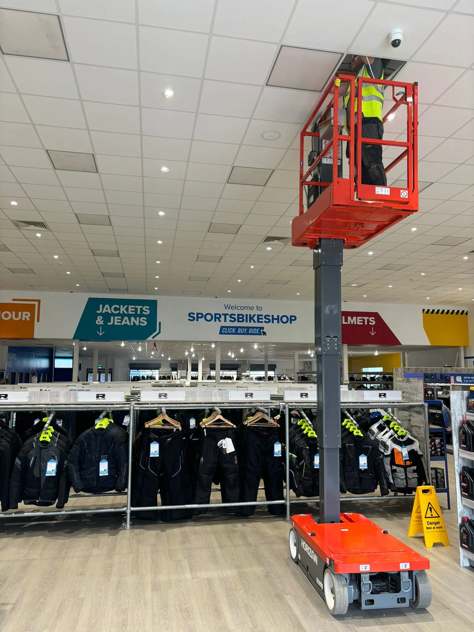 Circuit Works electrician with cherry picker on commercial job site